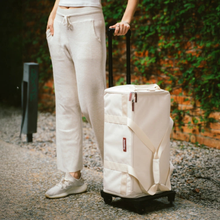 Traveler pulling the JenniBag 2.0 Roller Edition outdoors