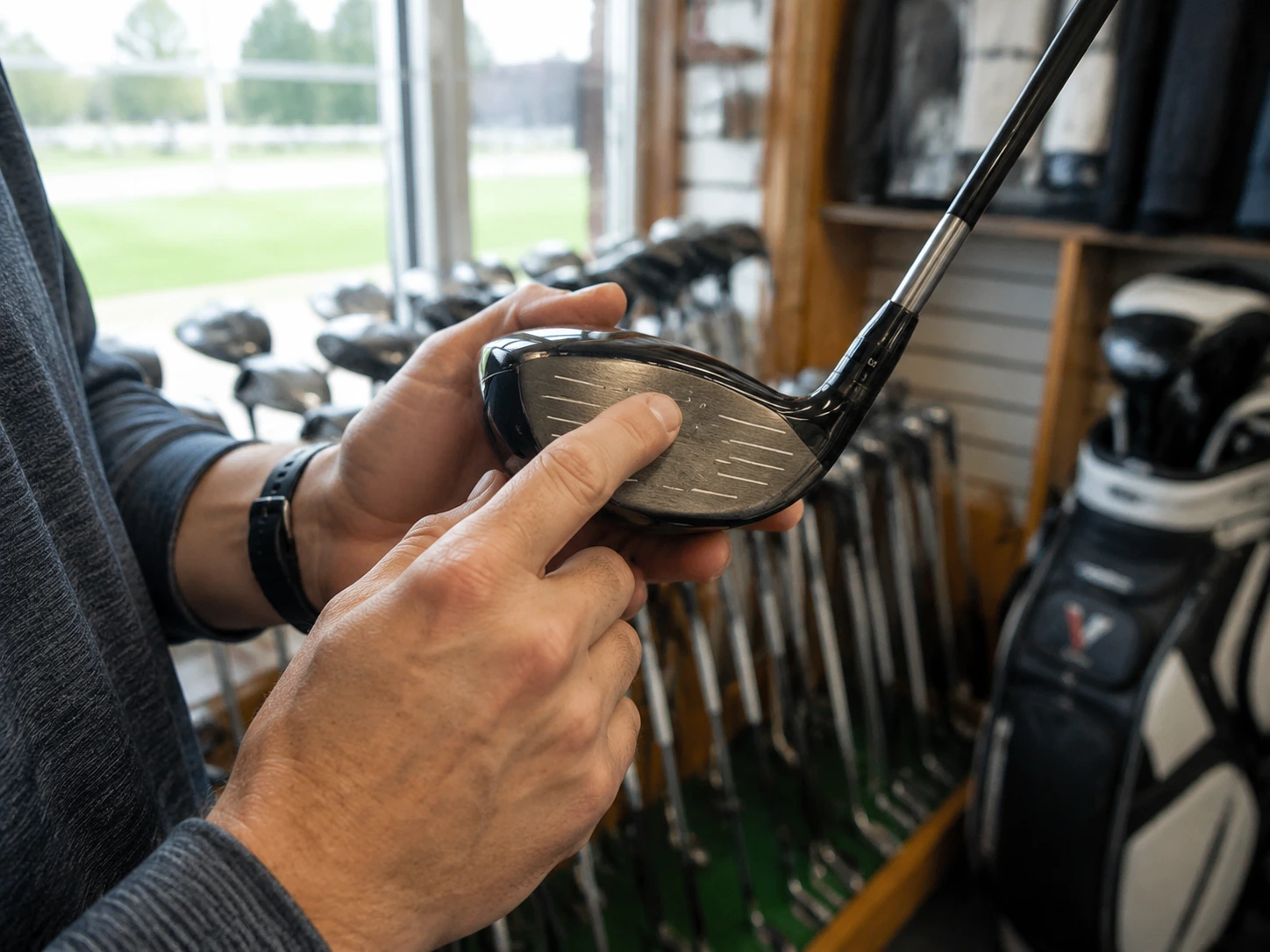 Used golf club being inspected for authenticity and condition
