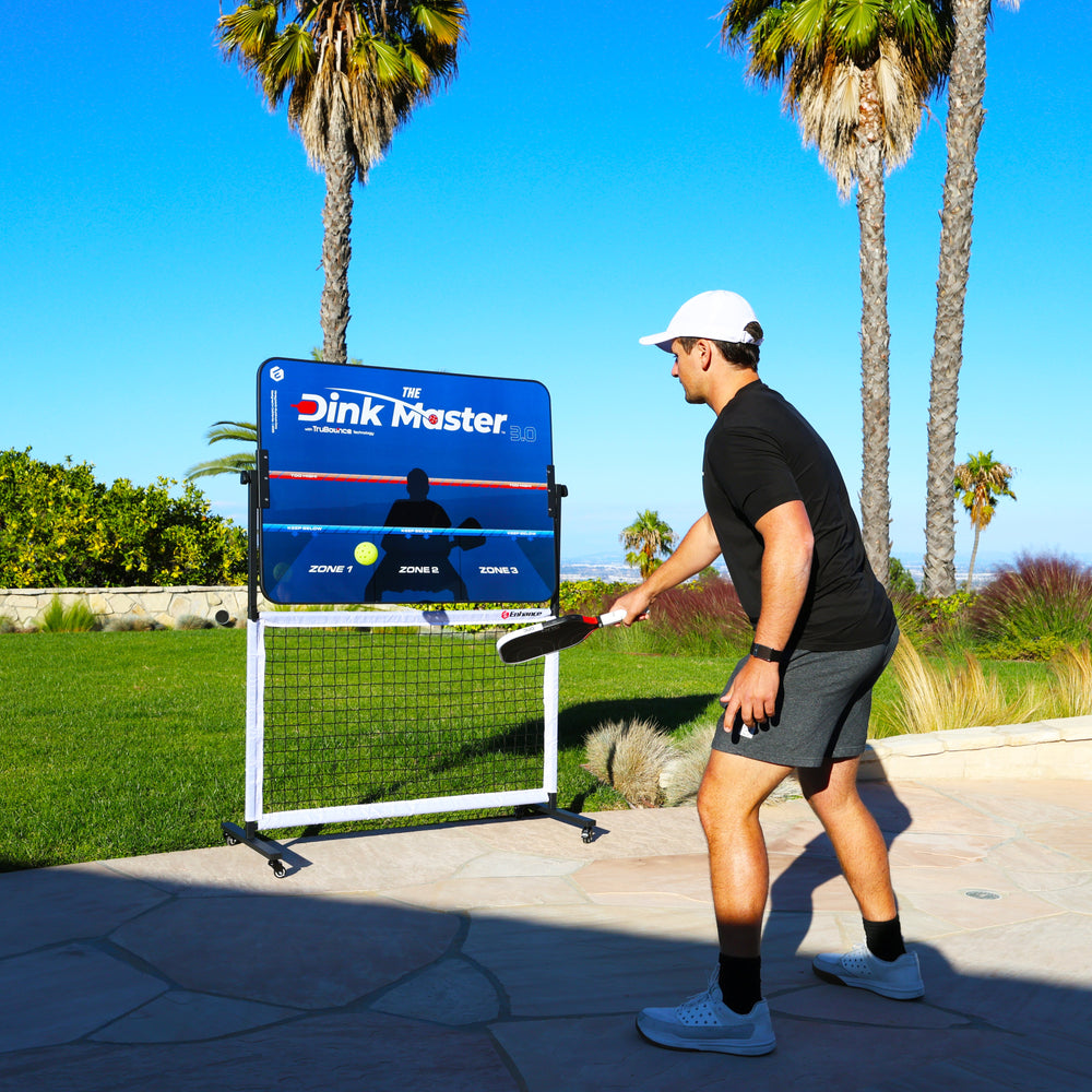 Player practicing with the Dink Master 3.0 pickleball rebounder